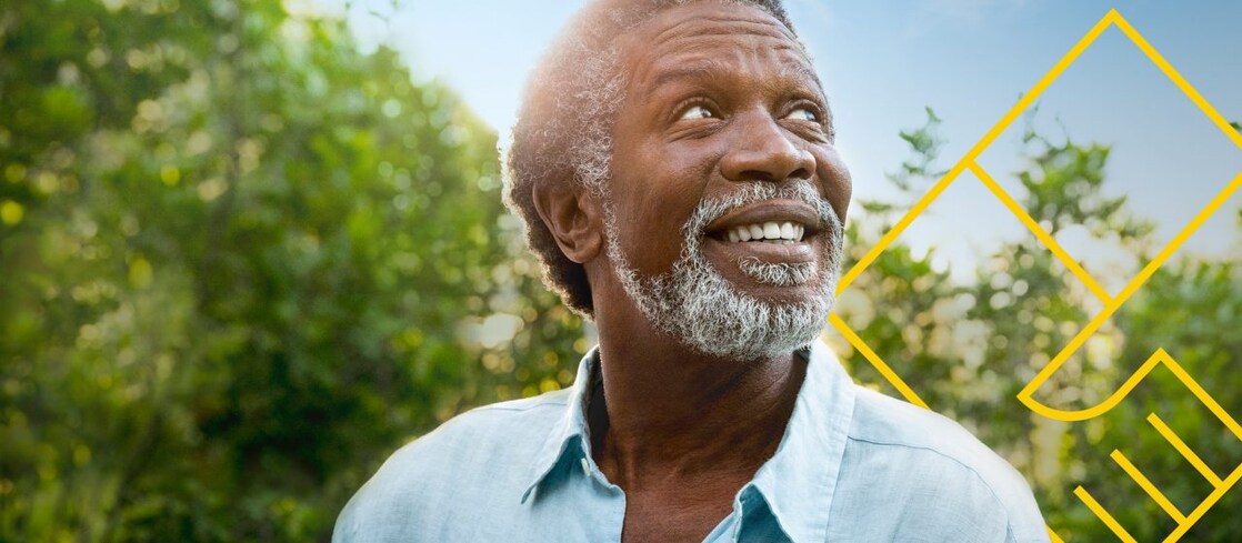 Smiling man with a beard in front of trees with an outline of the Generating shareholder value graph