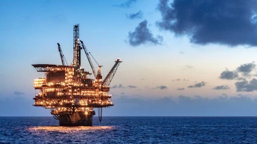 Offshore oil platform in the sea lit up at night