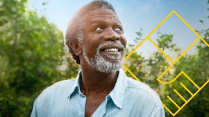 Smiling man with a beard in front of trees with an outline of the Generating shareholder value graph