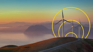 Photo of three wind turbines on a hill with an outline of the Achieving net-zero emissions graph