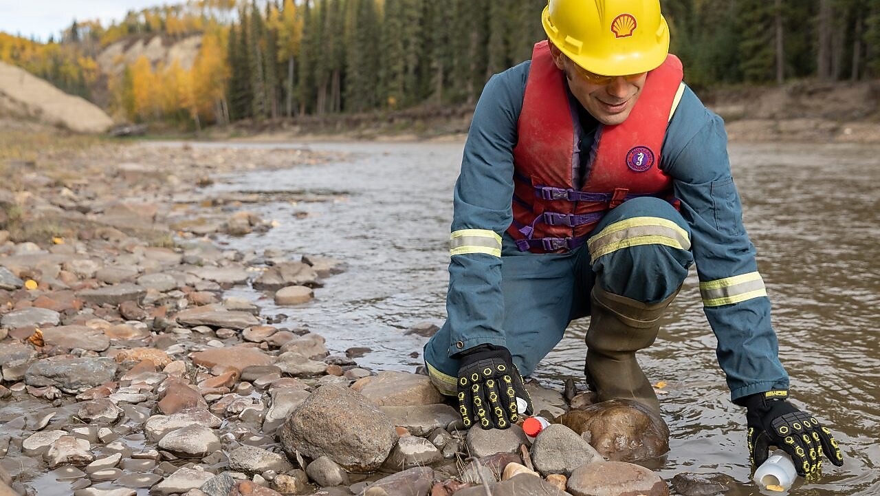 Shell employee gathering river water