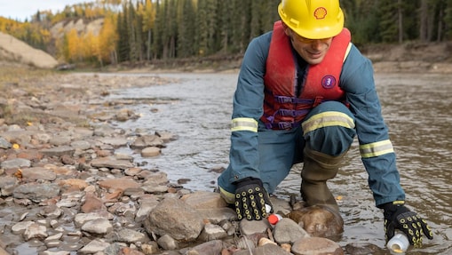 Shell employee gathering river water